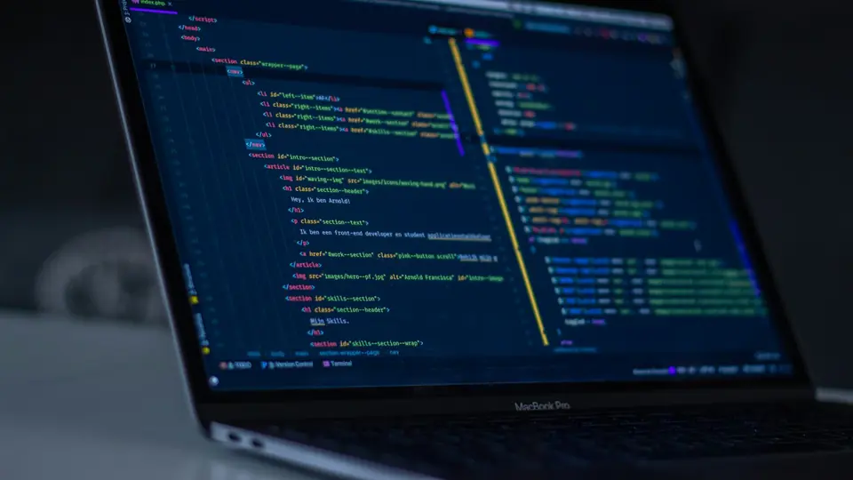 A laptop screen showing a code editor, illustrating software tools used to work with AI models.